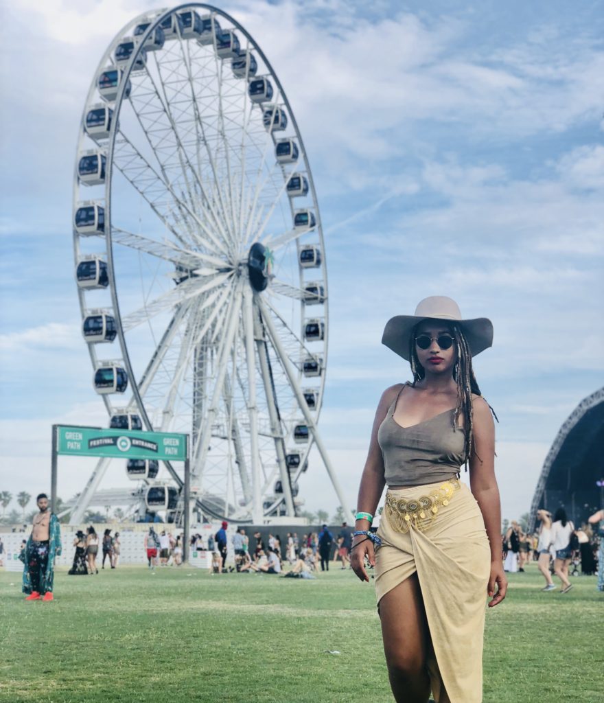 Coachella classic picture in front of ferris wheel with festival outfit