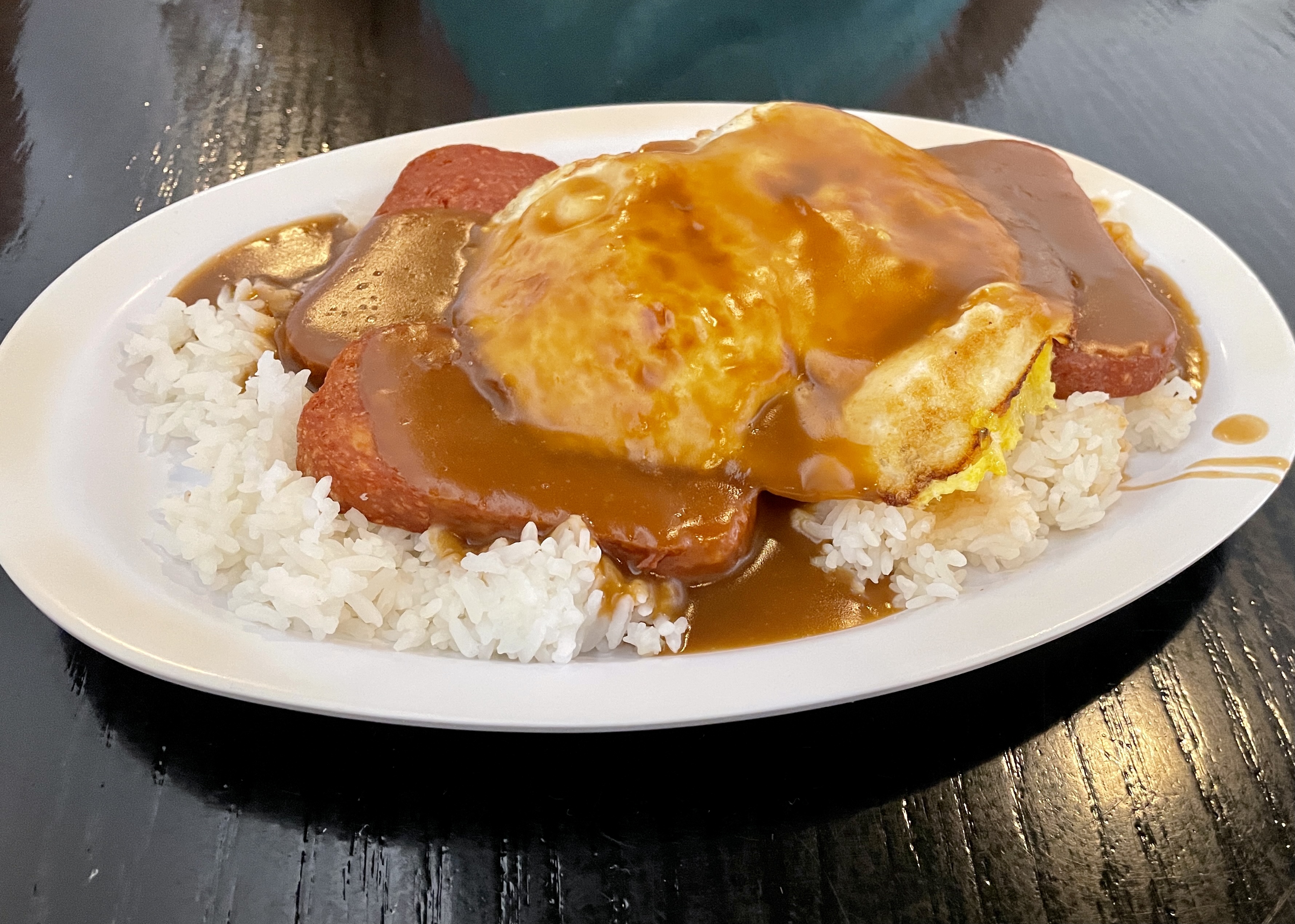 Loco Moco with rice, spam, eggs over hard, and brown gravy