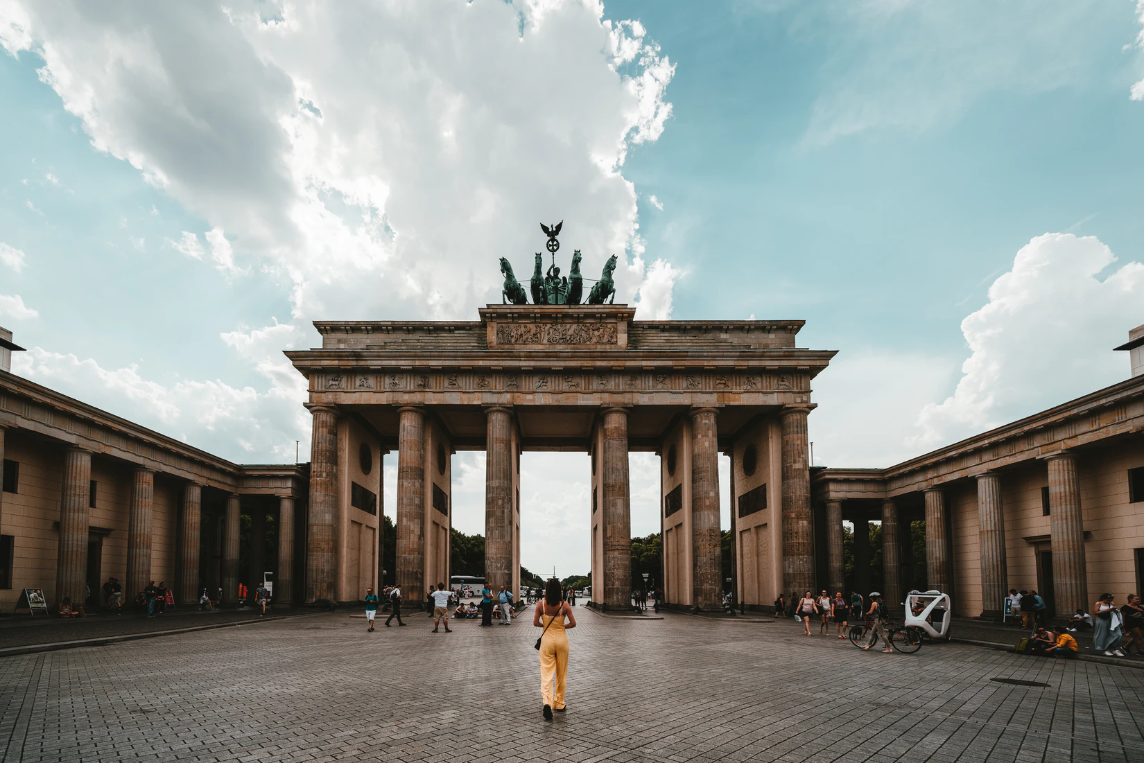 Woman standing in front of Brandenburg Gate in Berlin, Germany