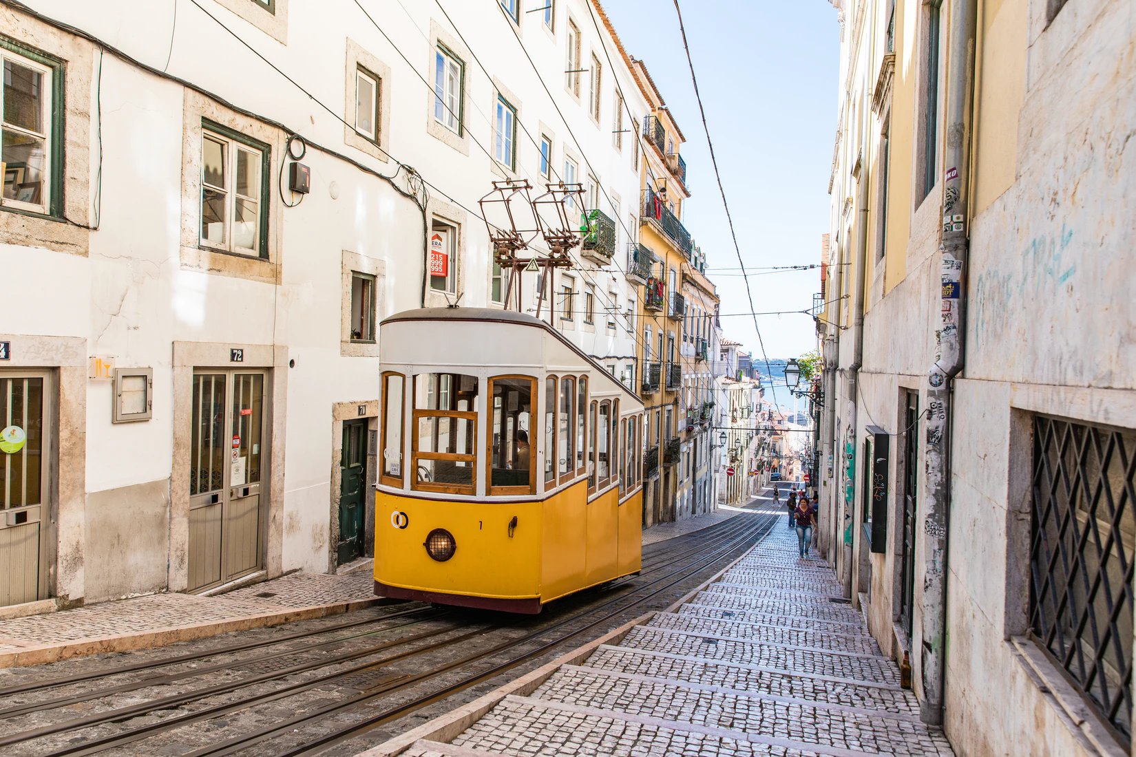 Yellow cable car operating in Lisbon, Portugal